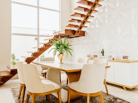 Modern dining room interior design in Canada with wooden table and chairs